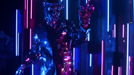 A-glittering-shiny-man-in-a-suit-of-mirrors-dances-in-the-neon-light.